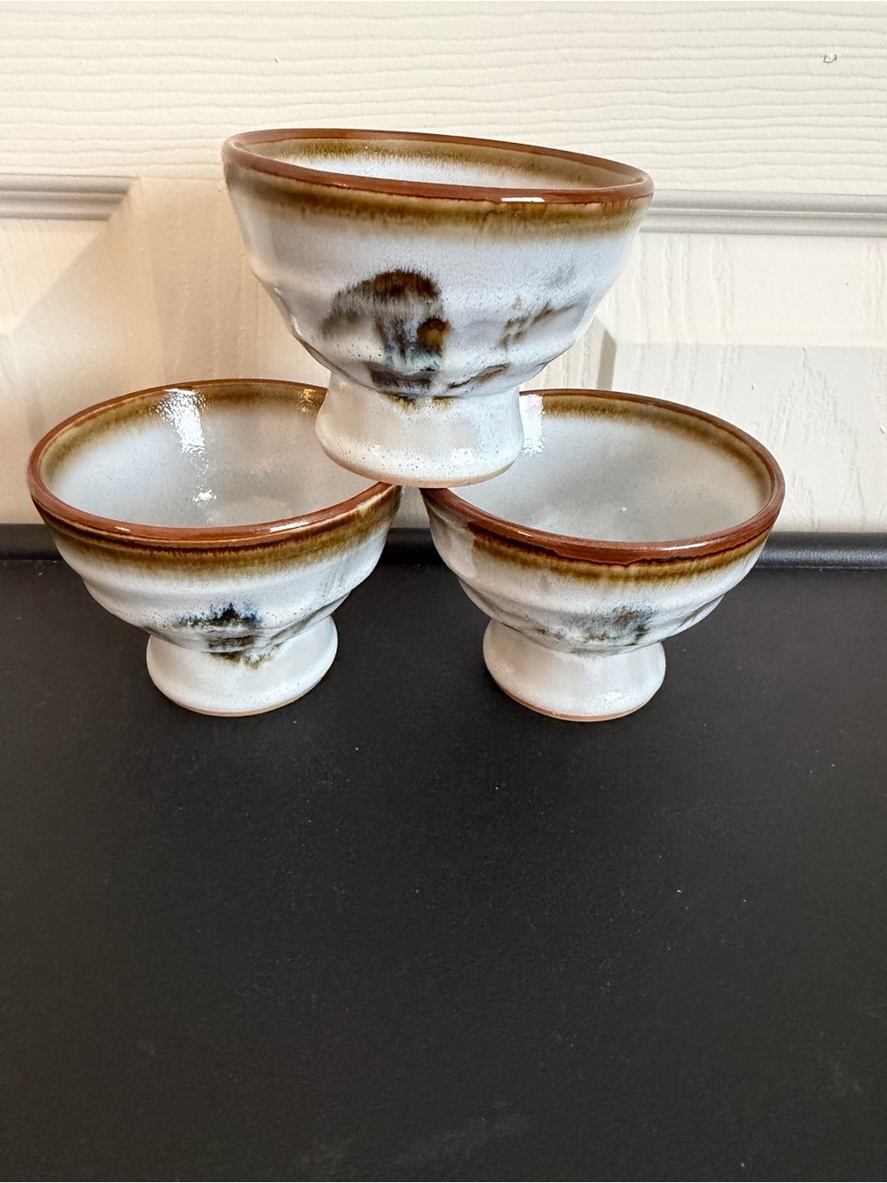 Japanese stoneware pedestal cups Sake or tea cups. Set of 3.